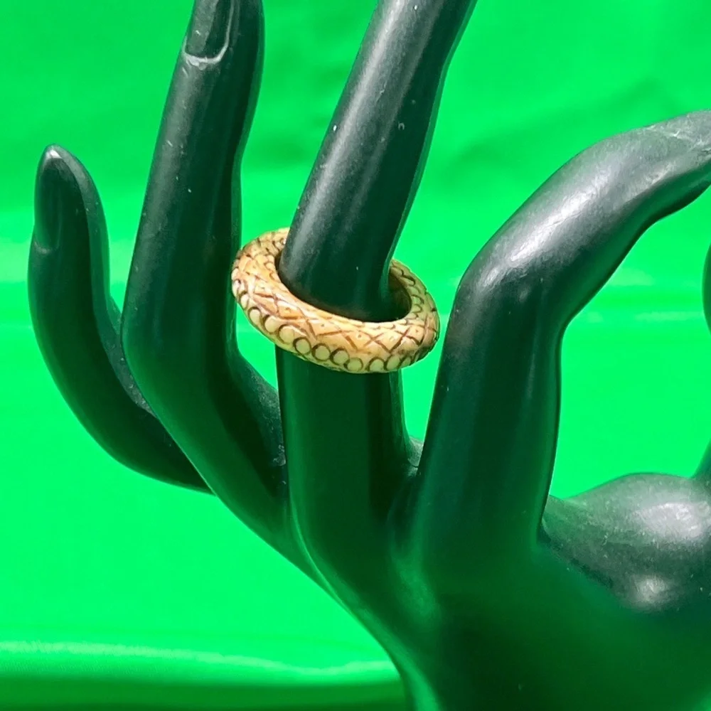 Natural Tan snake carved design. Wood or resin?
